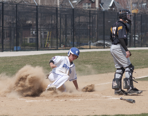 Spartans split home opener double header against Wooster