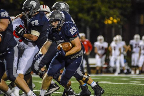 Burke, Henderson lead Spartans over Wolverines