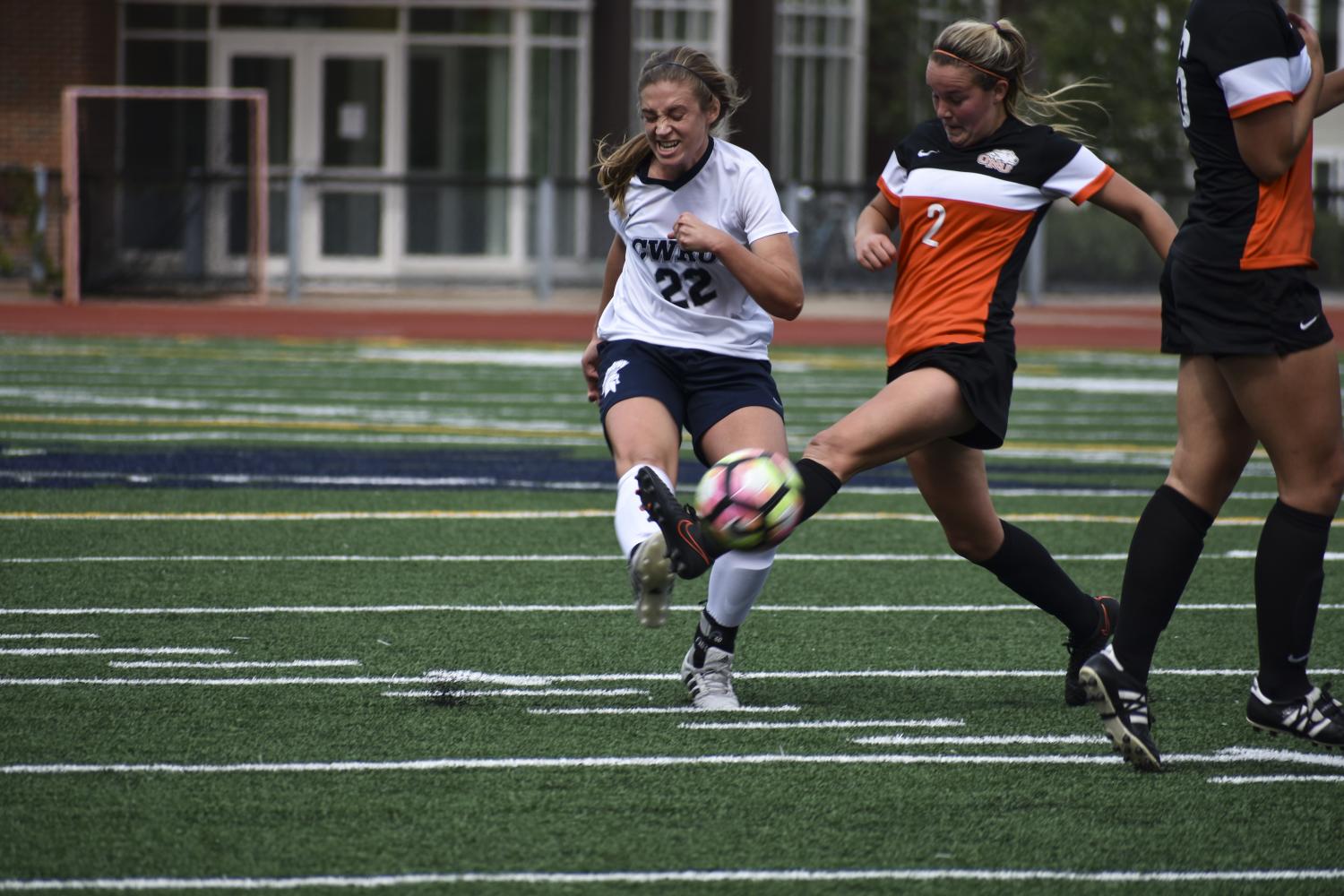 Kicking the ball past a defender earlier in the season, fourth-year midfielder Elle Zadina braces for impact. The Spartans lost their first conference match, but rebounded with a win on Oct. 3.