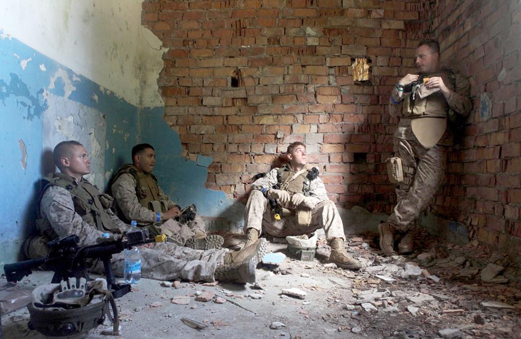 CWRU student Steven Maire, pictured far right, takes a lunch break with team members while stationed in Afghanistan.
