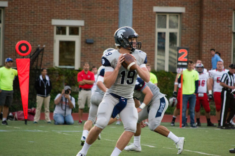 Senior Quarterback Billy Beecher looks for a recieved back agianst Carengie Mellon in season opener.