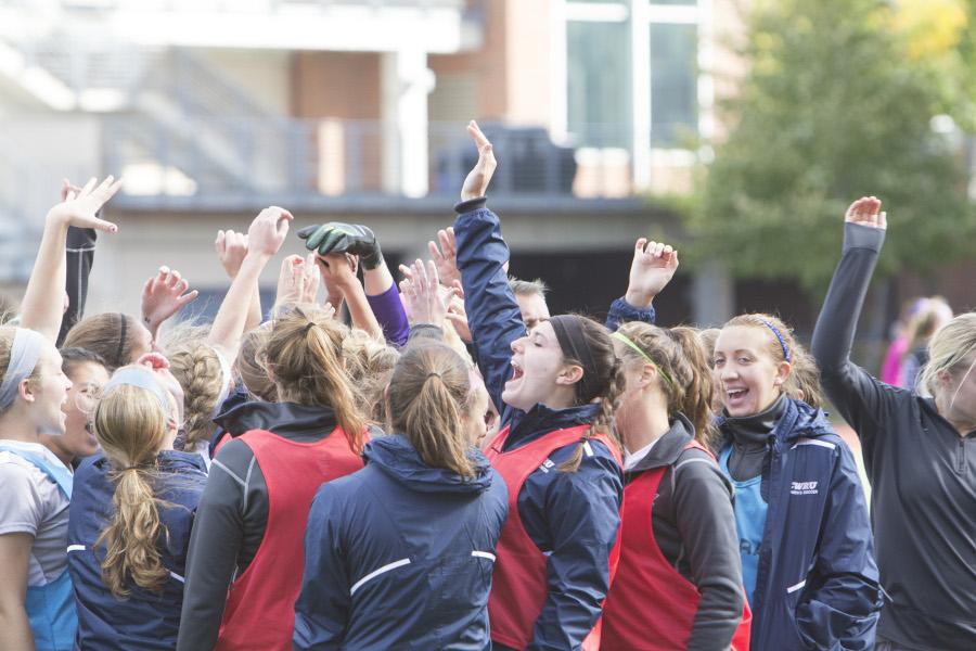 Women’s soccer team cheers at start of overtime against New
York University.