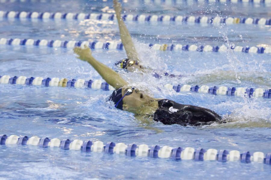 Spartan and Allegheny swimmers race to the wall in meet last weekend.