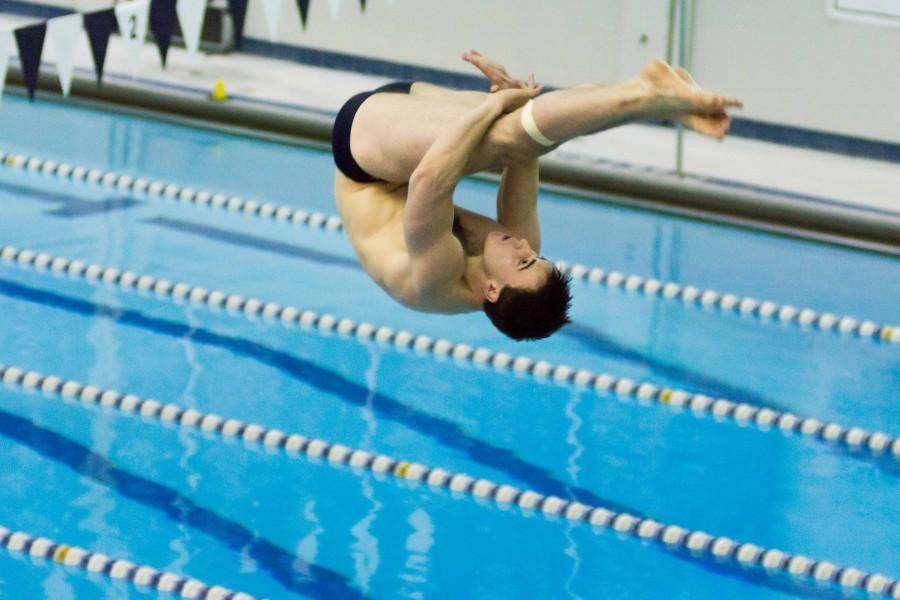 Men’s diver Connor Farrell mid-dive. Farrell had two first place dives for the Spartans.