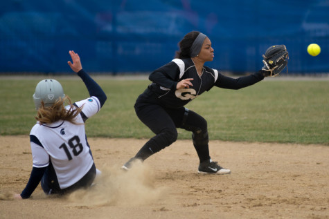 Freshman Grace Tritchler slides safely into second in the Spartan’s win over Geneva during the home opener doubleheader.