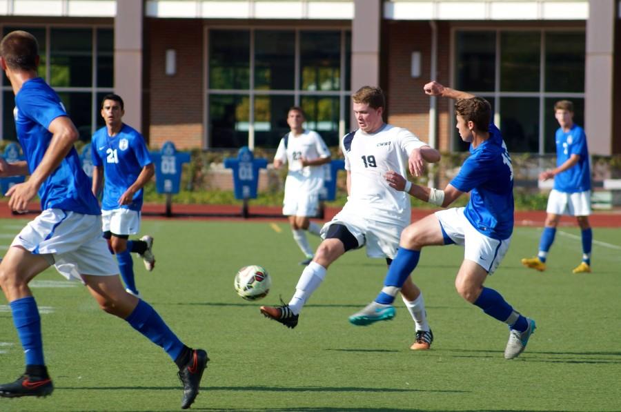 Midfielder Paul Darmstadter clears the ball up field against Thomas More. The Spartans split their first home series but rebounded this week against Baldwin Wallace. 
