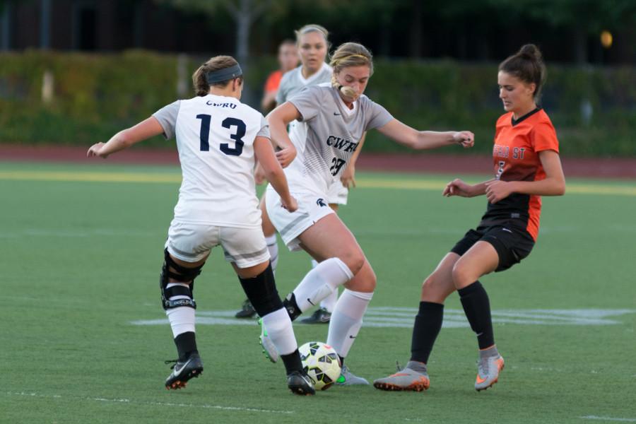 The Spartans battle for the ball earlier this season against Buffalo St., the Spartans slipped against UAA rivals this weekend. 