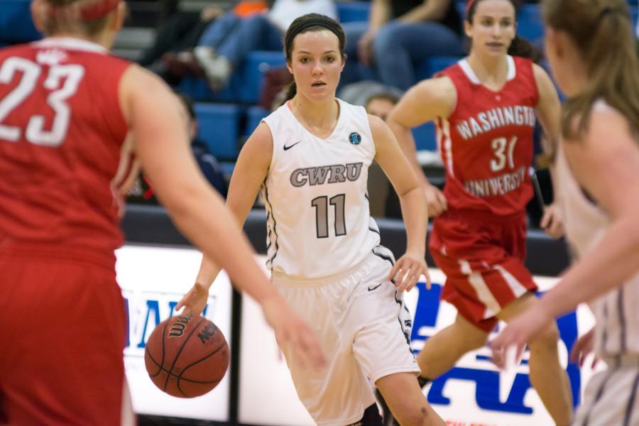 Emily Young dribbles through traffic against Washington University earlier this season, despite recent losses the Spartans have continued to improve.
