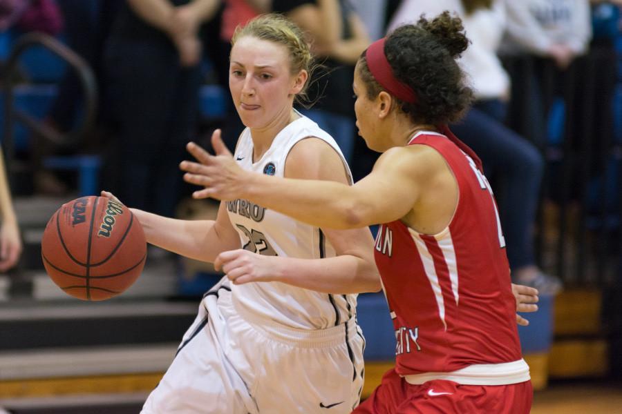 Jessica McCoy drives around her defender in a game earlier this season. McCoy and the Spartans return home to take on Brandies and NYU for Throwback Weekend.