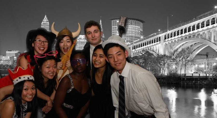 Students+pose+with+props+in+the+Snowball+photo+booth%2C+one+of+the+attractions+at+the+annual+dance+downtown.