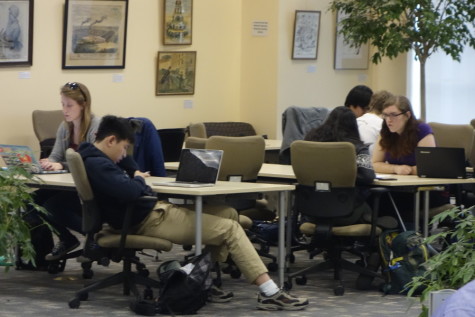 Students studying in Kelvin Smith Library. To succeed, take care of yourself.