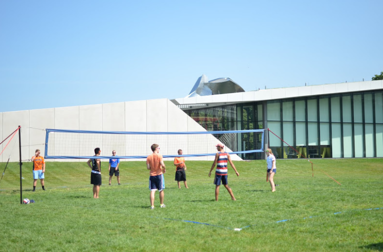 Students are playing volleyball together in last years student activitiy fair.