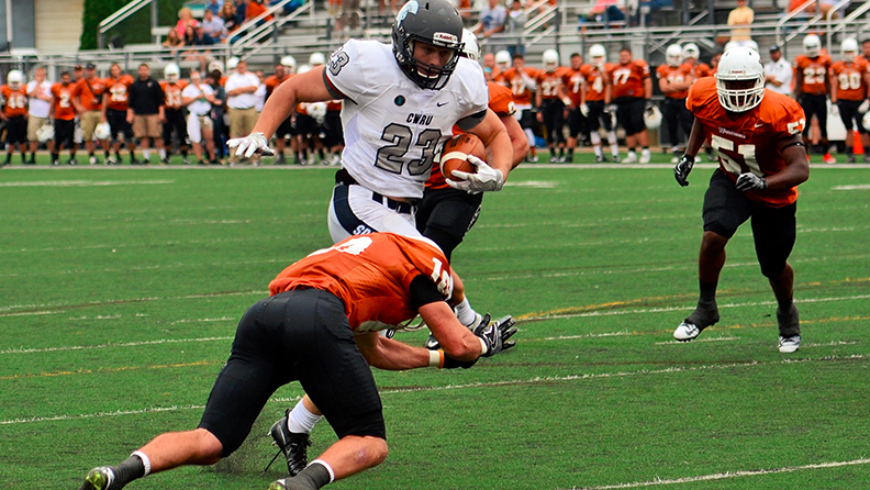 Jacob Burke dodges a Waynesburg defender during one of his 20 rushes. He set career highs in carries, yards and touchdowns in the Spartans victory. 