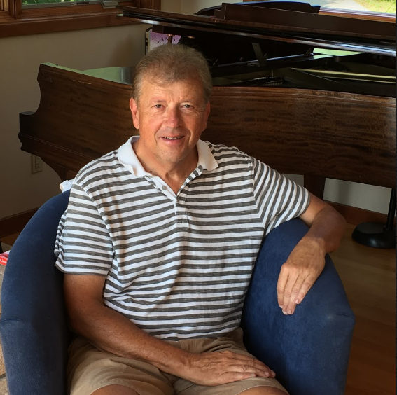 Dr. Gary Ciepluch sits on a couch of his Wisconsin lake house, where he will move permenantly after his retirement. 