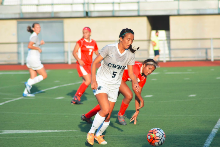 Forward Kimberly Chen keeps her eye on the ball as she receives a pass during an early season match.