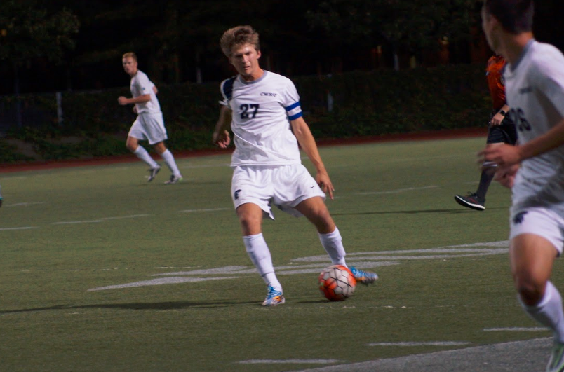 Third-year forward Michael Balog passes to first-year midfielder Brian Woo during a match earlier this season.