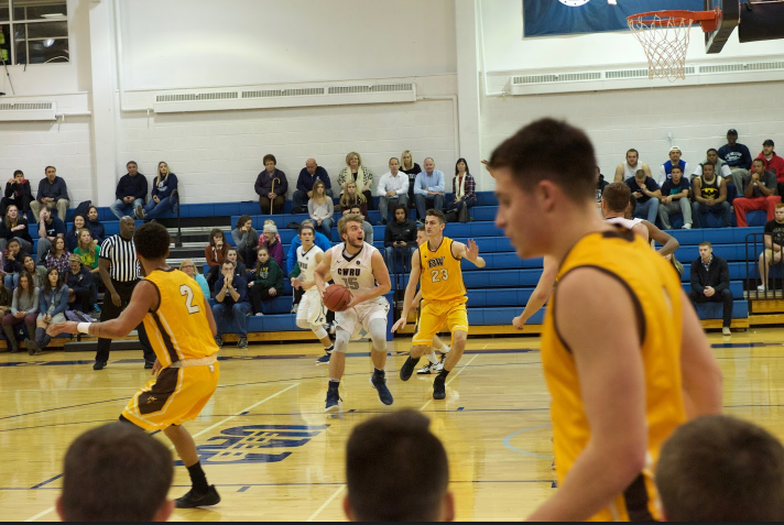 David Black goes up for a shot in the paint during a game earlier in the season. Black scored nine points and nabbed three rebounds in the loss to Adrian.