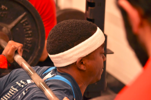 Graduate student Devin Gordon digs deep as he attempts a squat during the IM weightlifting contest. 
