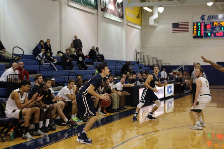 First-year forward Sam Hansen lines up a three-pointer during a game earlier this season.