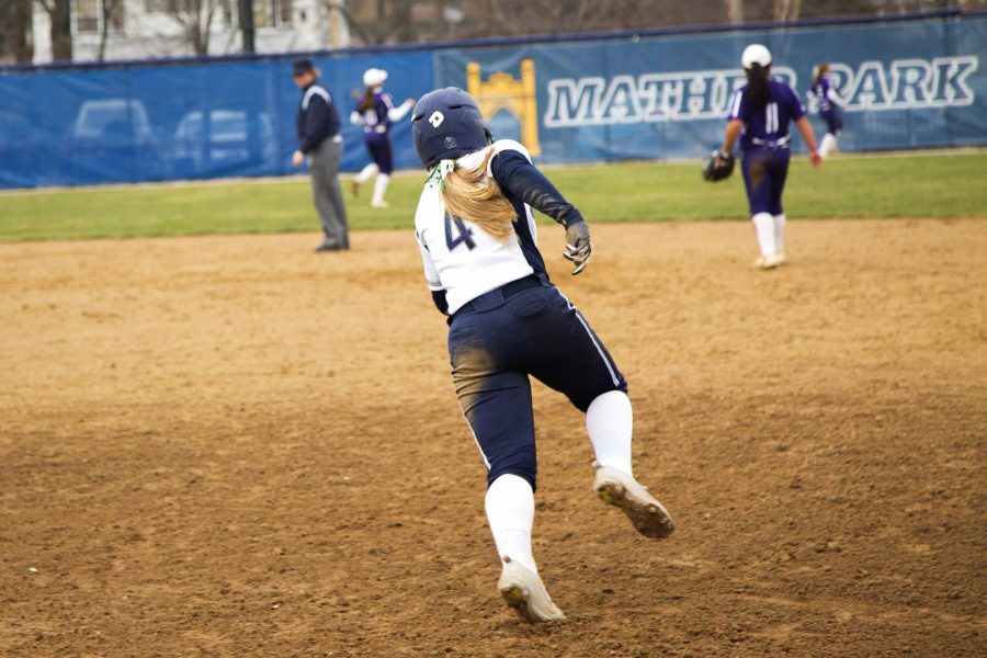 Infielder+Nicole+Doyle+rounds+first+after+hitting+a+deep+double+against+Kenyon.