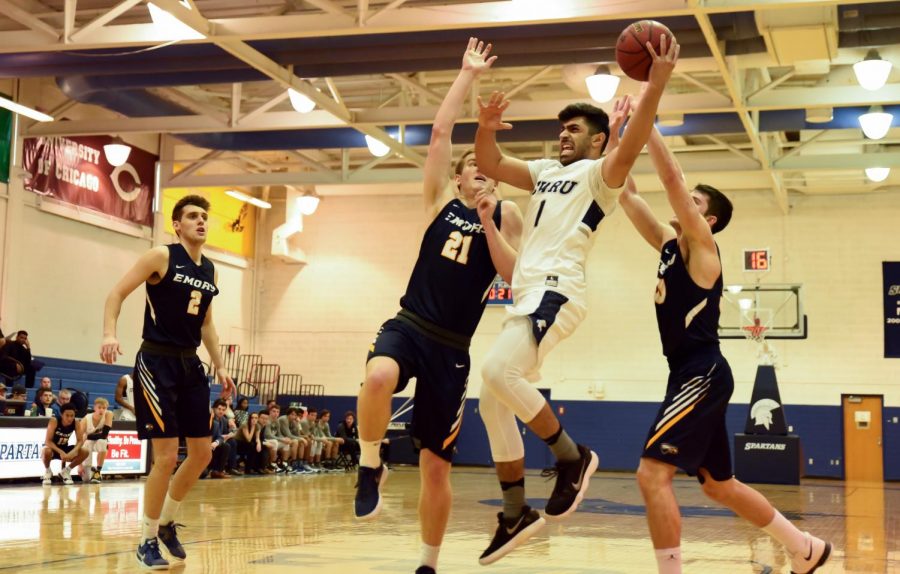 Third-year guard Monty Khela heads towards the basket. The Spartans faced Emory University and University of Rochester last weekend, ultimately falling to both. 