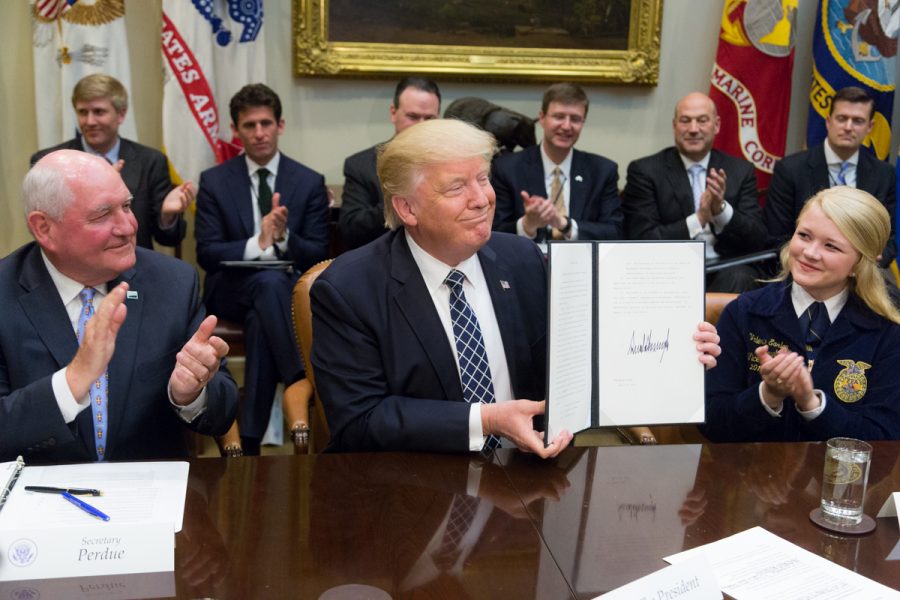 President Donald Trump displays the signed Executive Order promoting Agriculture and Rural Prosperity in America during a roundtable with farmers and agricultural commissioners in the Roosevelt Room of the White House in Washington, D.C., Tuesday, April 25, 2017. (Official White House Photo by Shealah Craighead)