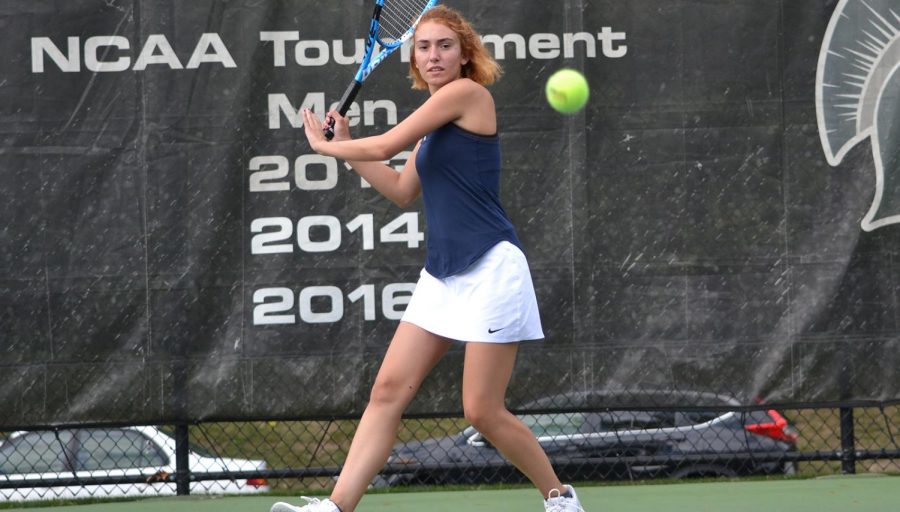 First-year Spartan Eliza Georgiades keeps her eye on the ball while competing in a tennis match. The women’s tennis team traveled to Florida for their spring break trip where they played five matches, claiming wins in three of them.