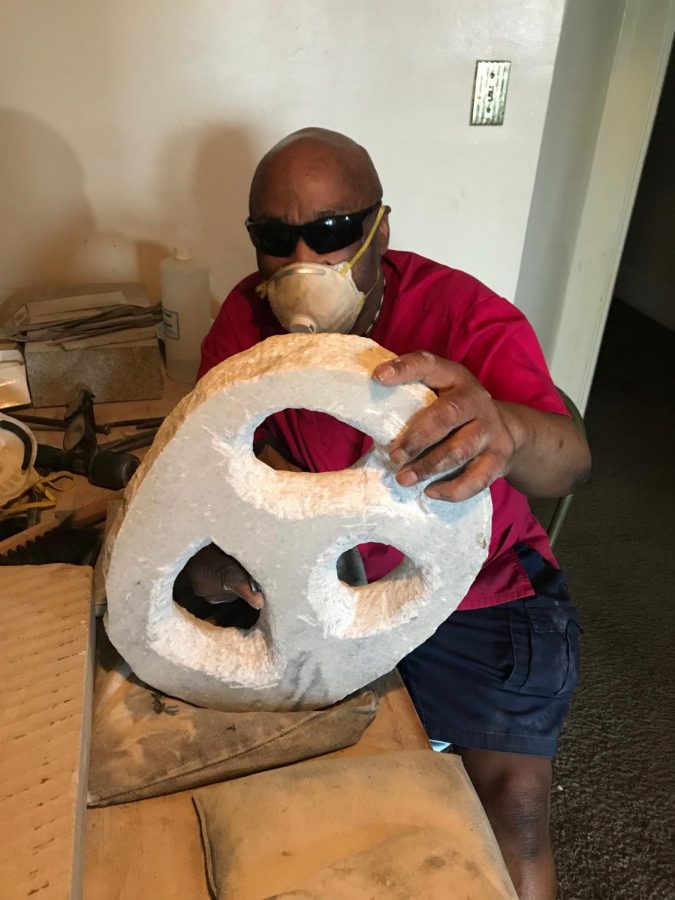 Chappelle Letman works on a new sculpture titled Trinity.