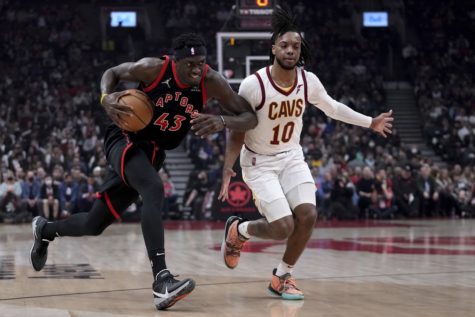 Toronto Raptors forward Pascal Siakam dribbles past Cleveland Cavaliers guard Tim Frazier during the two teams faceoff on March 24, one of several defeats for the Cavaliers in their late-season skid.