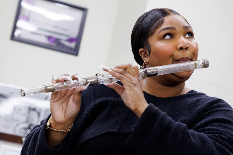 Lizzo practices on a glass flute once owned by James Madison—which was donated to the Library of Congress by late Case professor Dr. Dayton Miller.