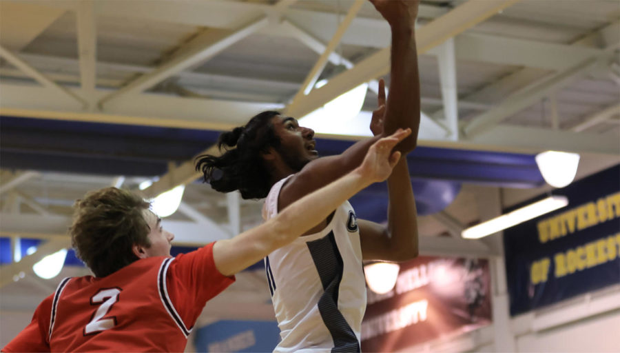 In CWRUs victory against WashU, second-year forward Umar Rashid (pictured) breaks the program record with nine blocks.