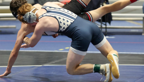 CWRU first-year Jacob Gregg grapples with his opponent during the Jan. 14 Claude Sharer Duals.