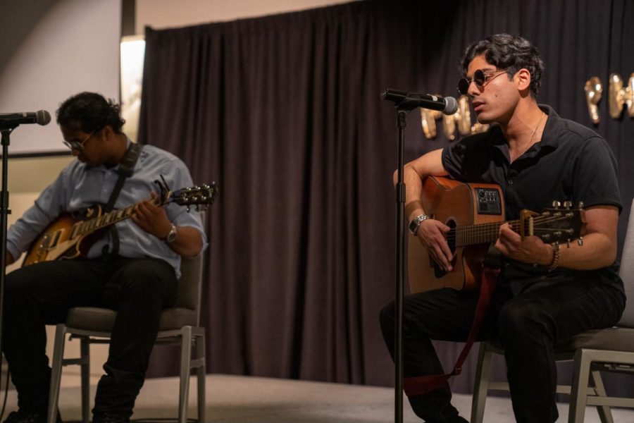 Pranav Nampoothiripad and Sohan Muppidi played and sang along to both Slide by the Goo Goo Dolls and Wonderwall by Oasis during their performance at PhiDEs first-ever talent show.