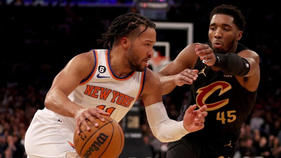 New York Knicks Jalen Brunson tries to dribble the ball past Cleveland Cavaliers Donovan Mitchell in a high-stakes series of playoff games that ultimately eliminated the Cavaliers.