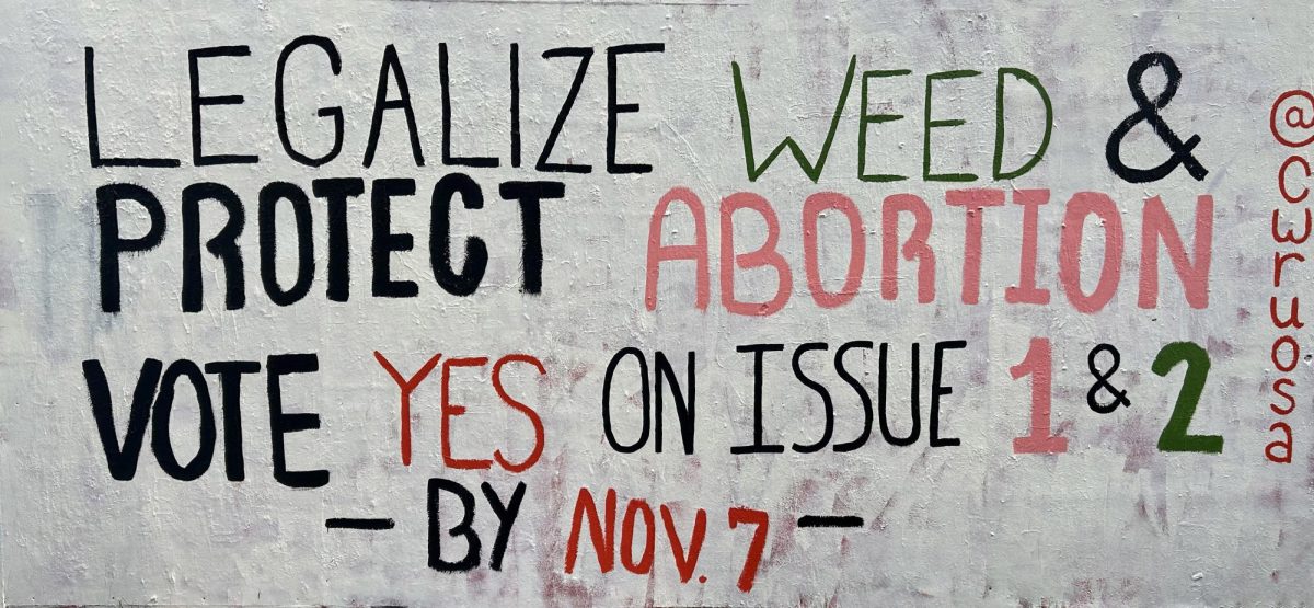 A sign outside the Thwing Center urges CWRU students to vote on reproductive rights and marijuana legalization in the upcoming Nov. 7 election.