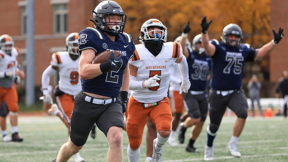 On Oct. 21, third-year running back Gage Duesler (left) scores 2 touchdowns in the Spartans game against Waynesburg University.  