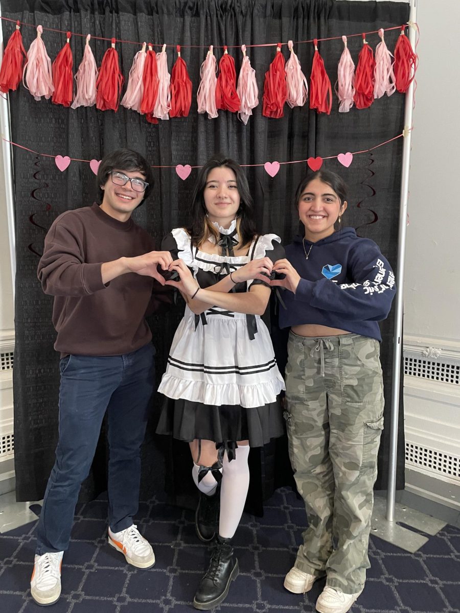 Tsunagari Japan volunteers, including Director of Digital Media Joce Ortiz (center), brought high-quality service, live performances and fun, giving customers a true maid cafe experience. 