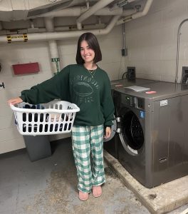 Third-year student Kaylin Hauck is excited do her first load of laundry in the new machines provided to CWRU by Fowler Laundry Solutions.