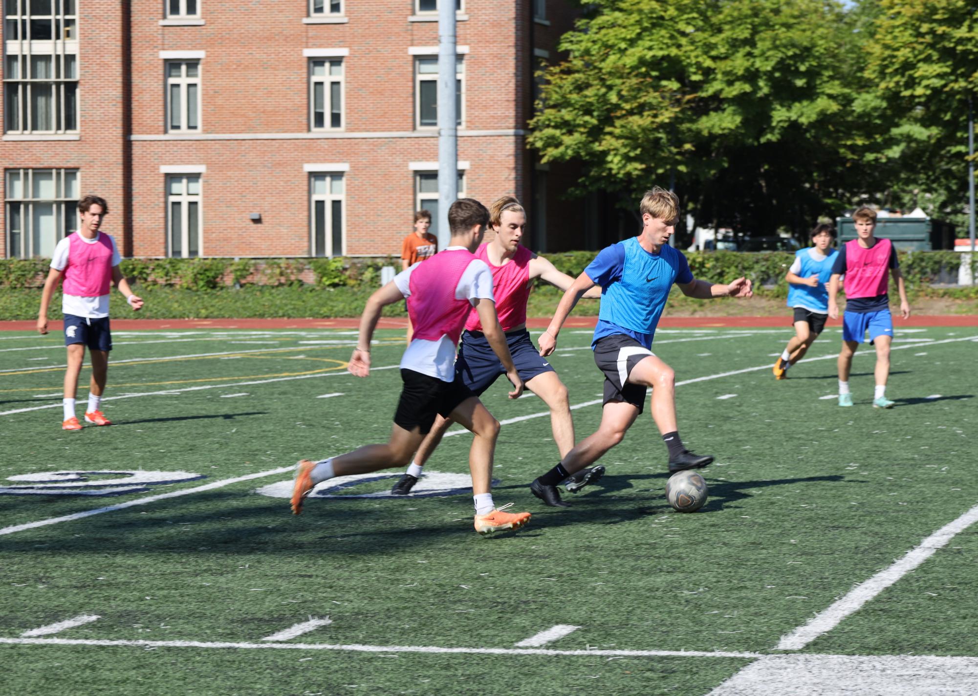 First-year defender Drew Rosenthal (left) is welcomed to the CWRU men's soccer team alongside veteran atheletes second-year midfielder Sean Wilson (right) and third-year forward McLaren Baggett (center). With the addition of ten new athletes to the roster, CWRU prepares for another successful season. 