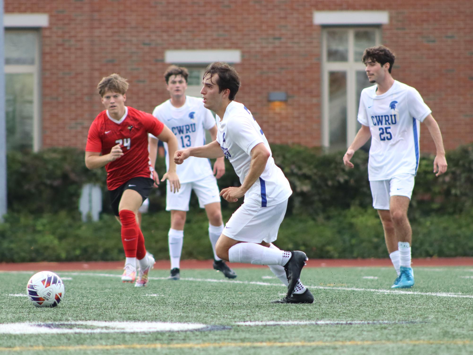 "Second-year defender Ian Manns (center) protects the Spartans' goal in a hard-fought match against Otterbein last Friday. He is joined by second-year defenders Cameron Thayer (left) and Daniel Sandall (right).
"