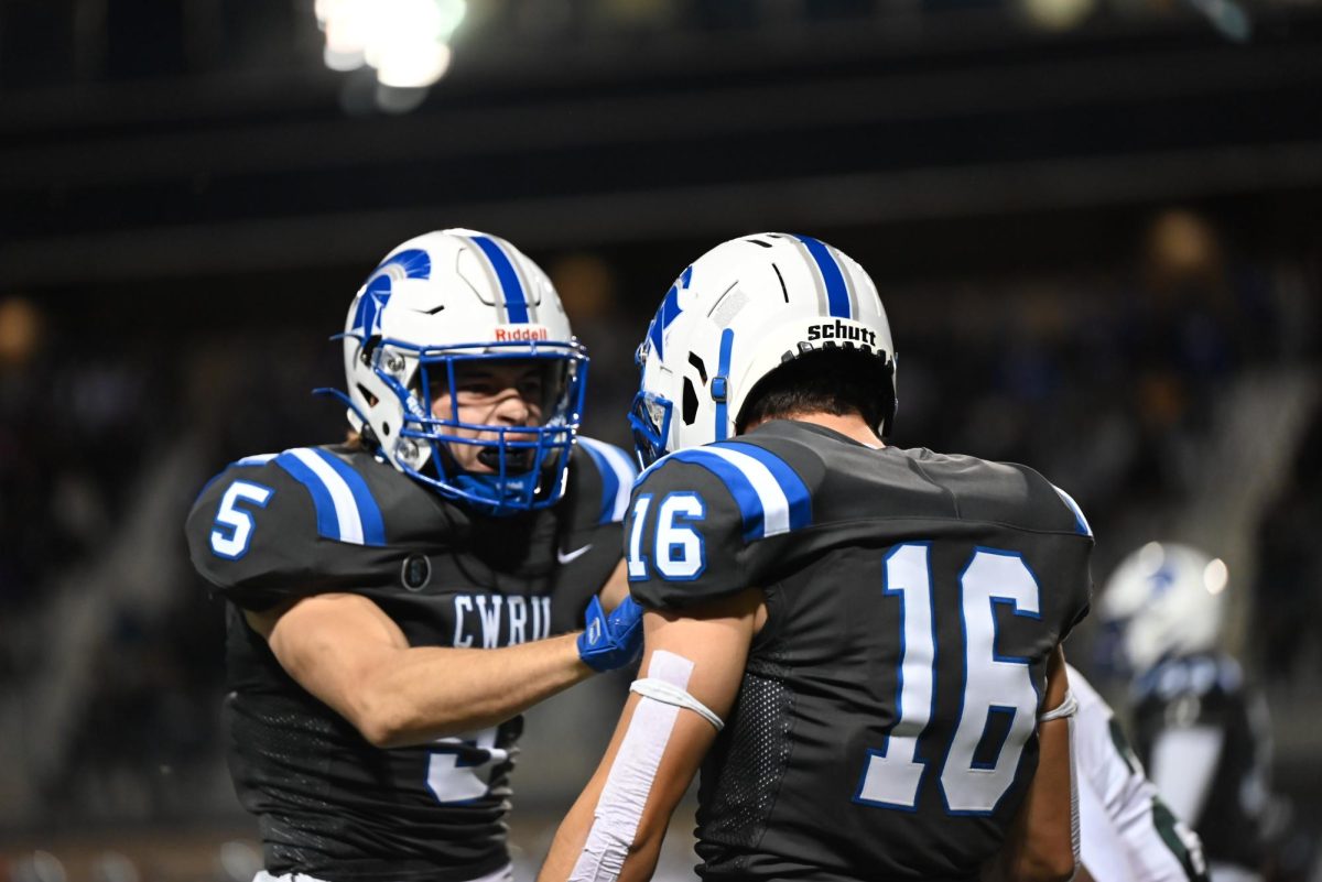 Fourth-year defensive backs Dominic Sais (left) and Nate Cikalo (right) hype each other up during the game. CWRU won 49-0 over Saint Vincent College.