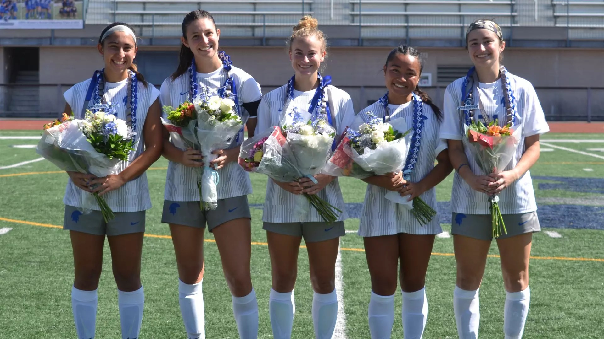 Left to right: Fourth-years Montgomarie Essex, Carolyn Koutures, Katie Rishel, Abigail Meneses and Sydney Schenk celebrate a successful season of women's soccer on their Senior Day