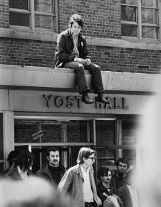 Students stand outside Yost Hall in protest of the ROTC. Student protests lead to CWRU's decision to discontinue the ROTC program. 