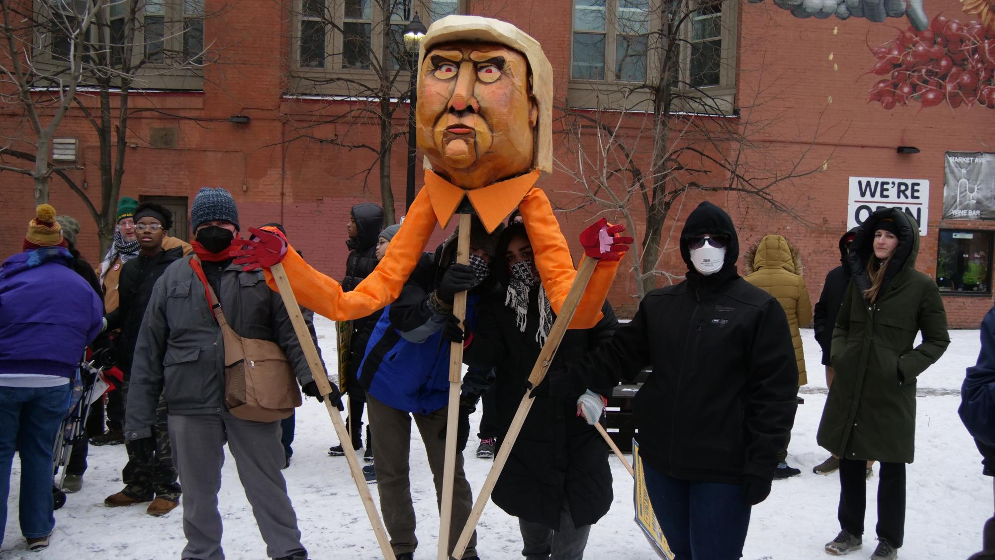 Protesters hold a large Trump puppet at the Jan. 25 Cleveland Fights Back march. 