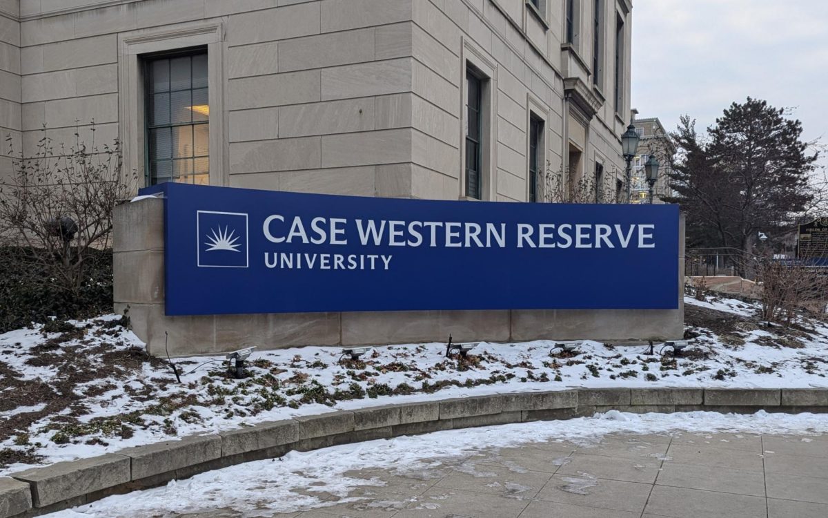 The new sign (right) in front of the Allen Memorial Medical Library, replacing CWRU's old logo (left) with the new one, has been met with mostly negative feedback, with students calling it "ugly" and "disgusting."