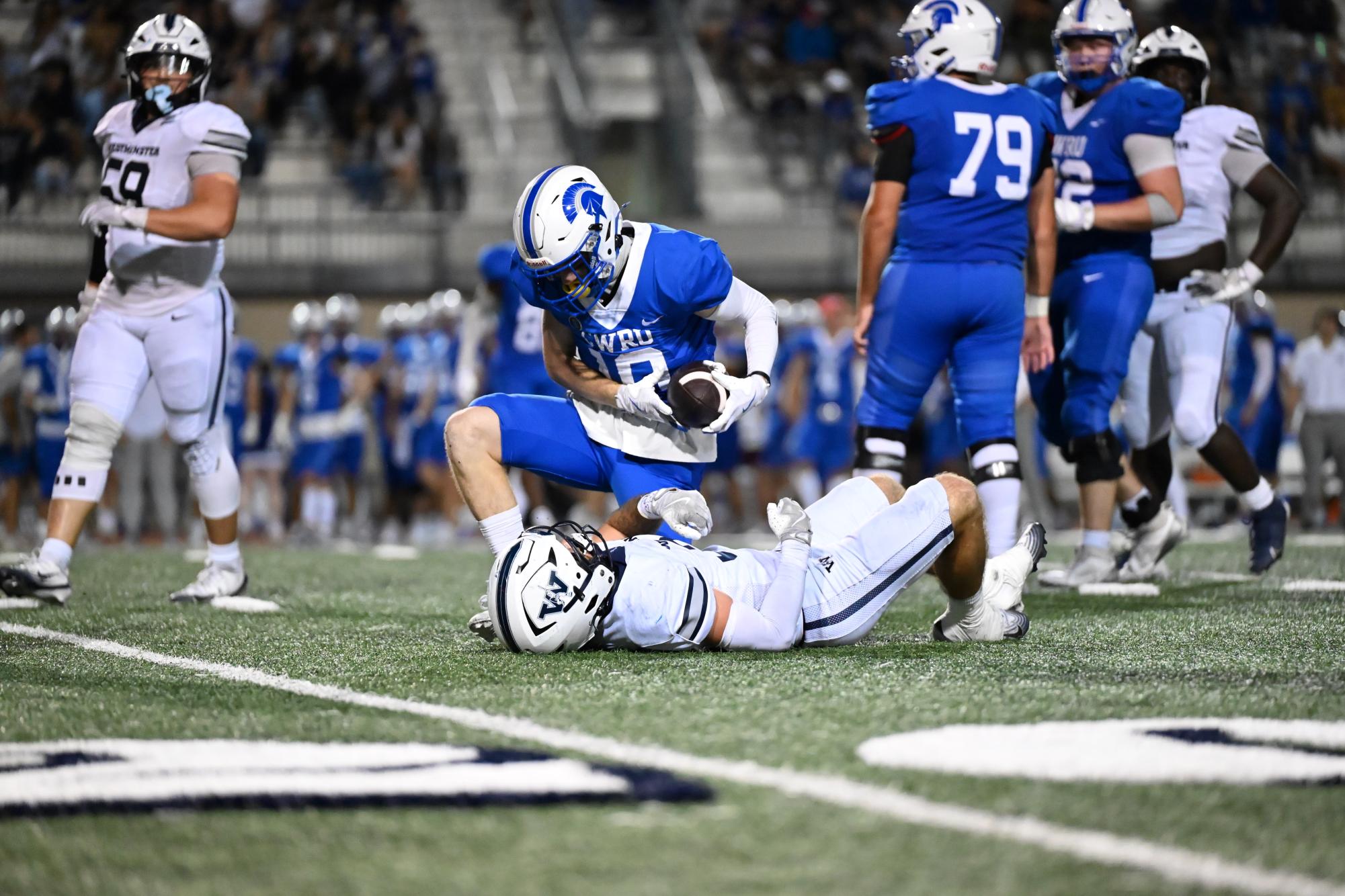 In their first home and conference game of the season, the Spartans narrowly fell to the Westiminster College Titans.