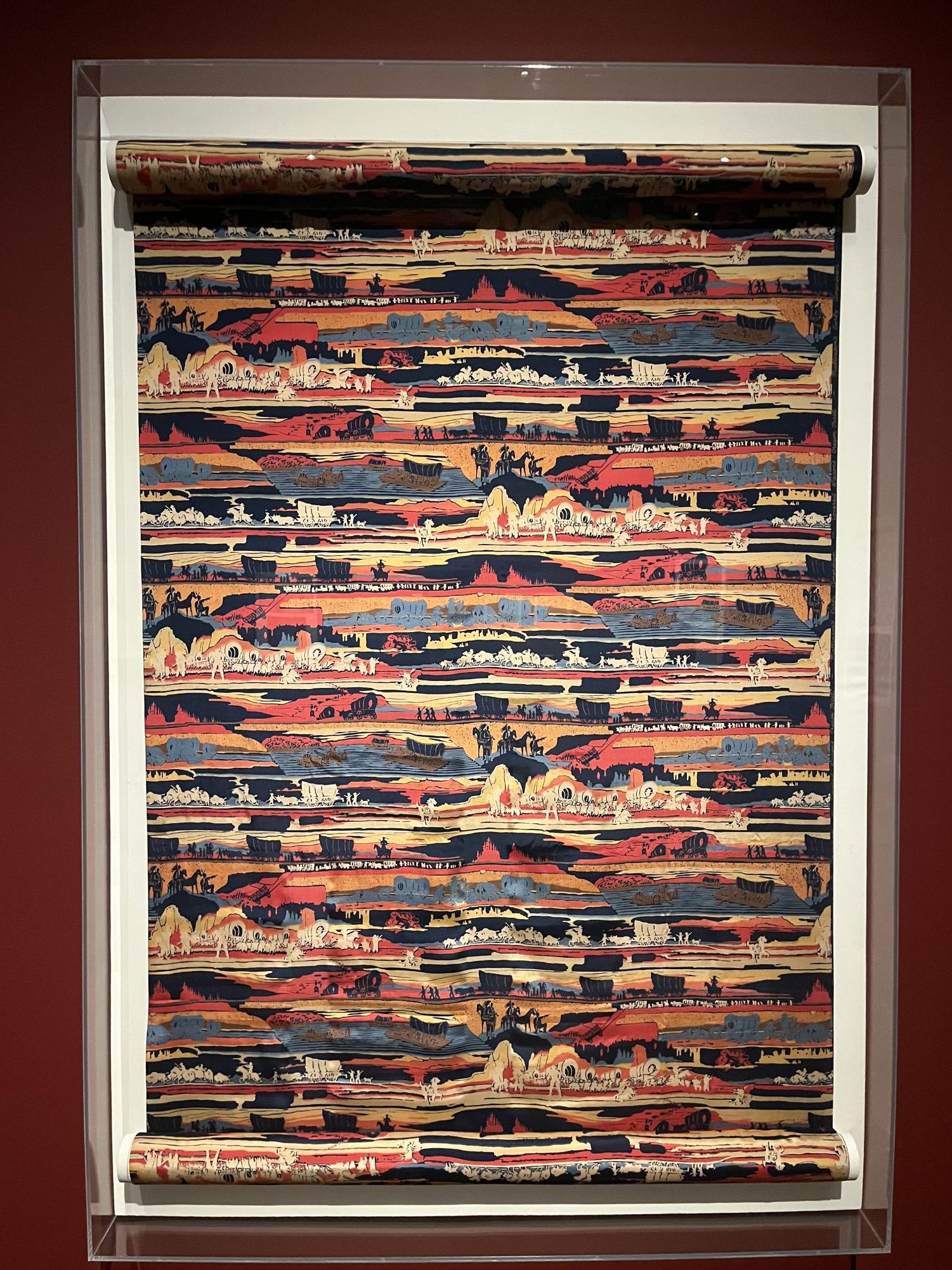 "Covered Wagons Oregon Trail" is a silk print produced by H.
R. Mallinson and Company in 1929 at the advent of the Great
Depression, conjuring up patriotic images in the wake of
World War I