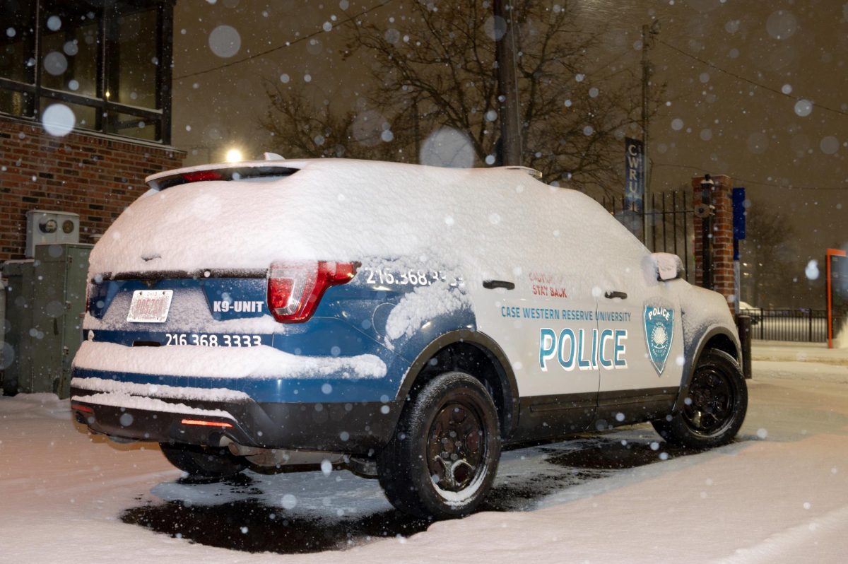 Snow covers a Case Western Reserve University police car on Dec. 16, 2025, in Cleveland. (The Observer/Tyler Sun)
